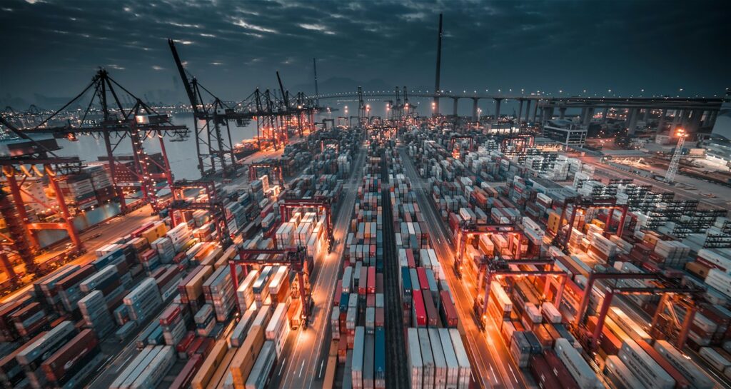 Port terminal with cranes and stacked containers