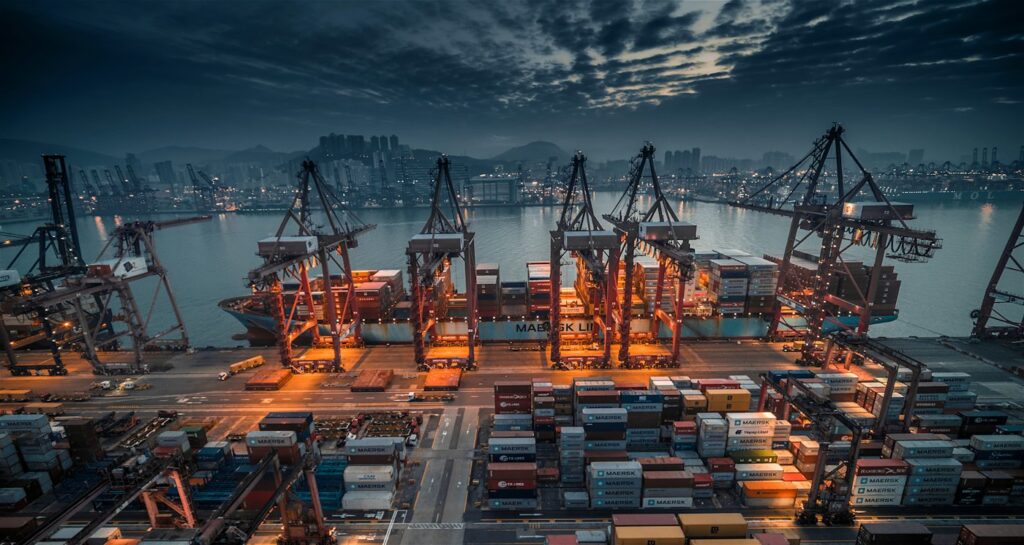 Container ship being loaded by cranes