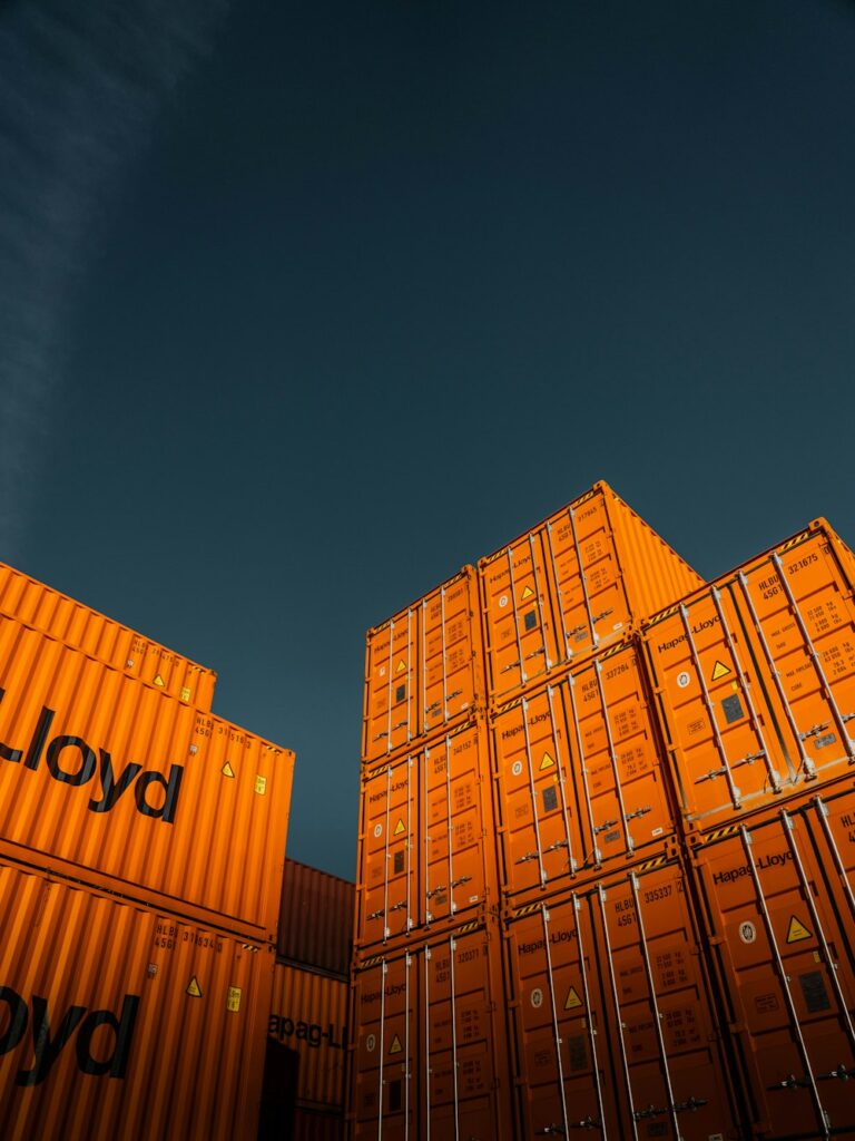 Orange containers against a blue sky